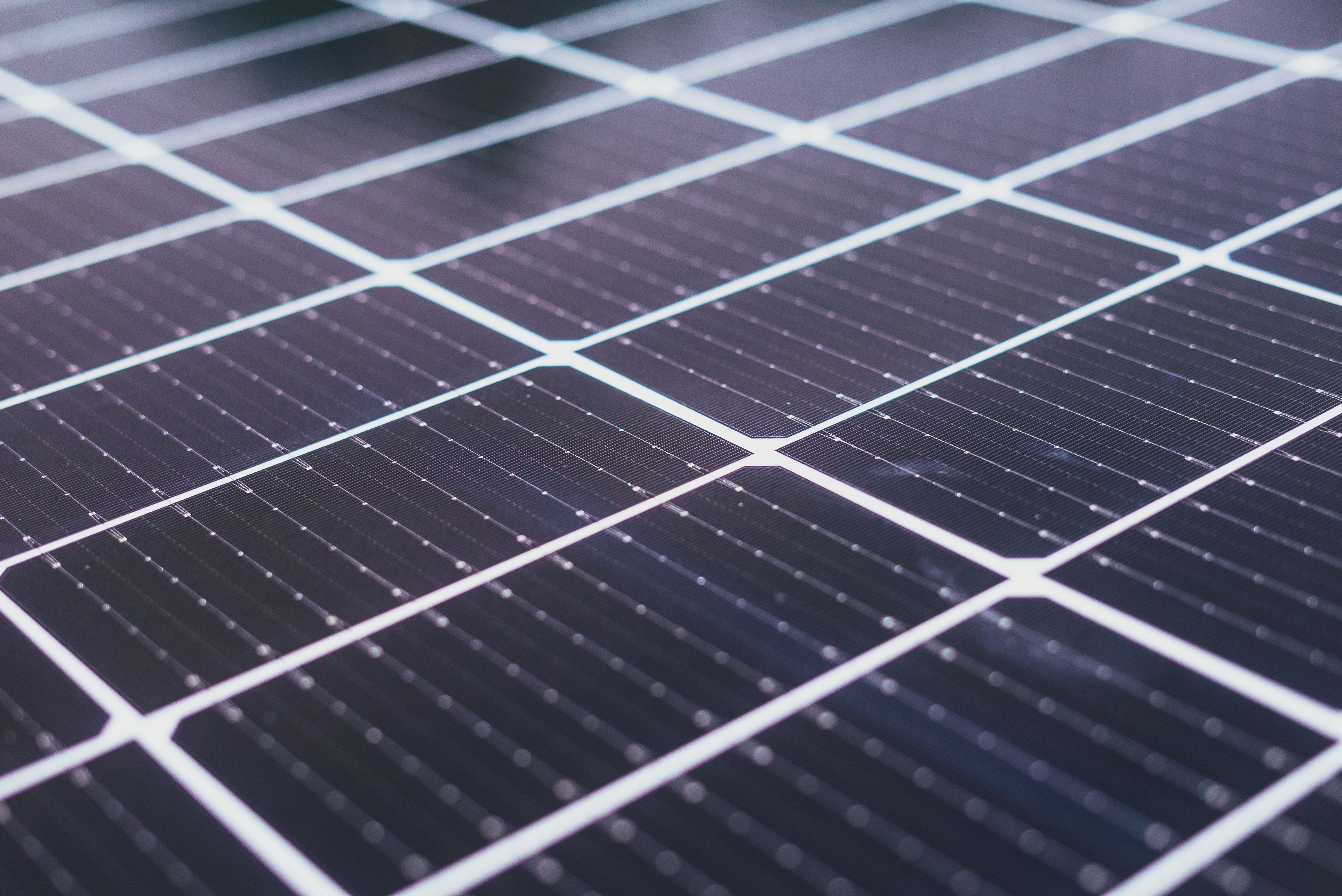 Close-up of solar panel cells, showing how solar can protect Long Island homeowners from rising electricity rates and higher energy costs.